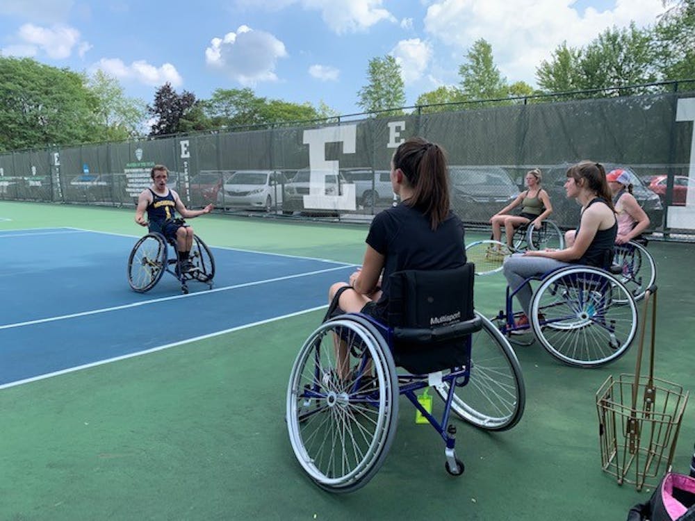 University of Michigan Wheelchair Tennis Athlete, Christopher Kelly, with EMU students Kaitlyn Healey, Kelly Zorn, Debbie Davison, and Allison Vetter. (Photo Courtesy of Heather Silander)
