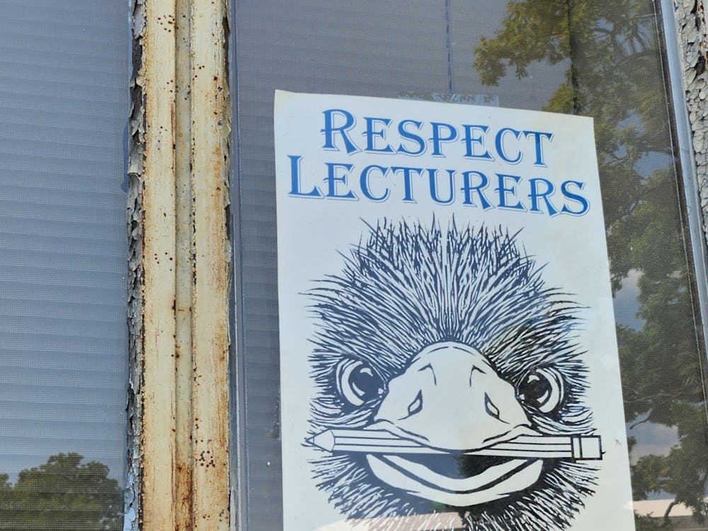A poster supporting the EMU Federal of Teachers union, and a character called Edna, has on the window of the classroom building at Eastern Michigan University in this Eastern Echo file photo.