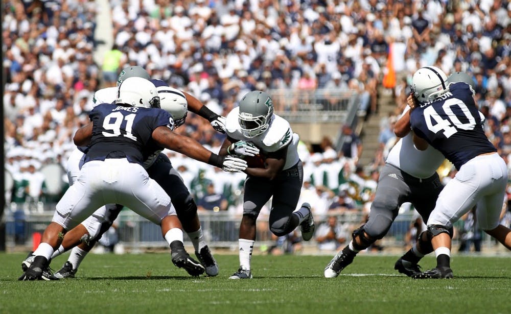 	EMU running back Bronson Hill looks for the open hole to make a big run in the 1st quarter against Penn St.