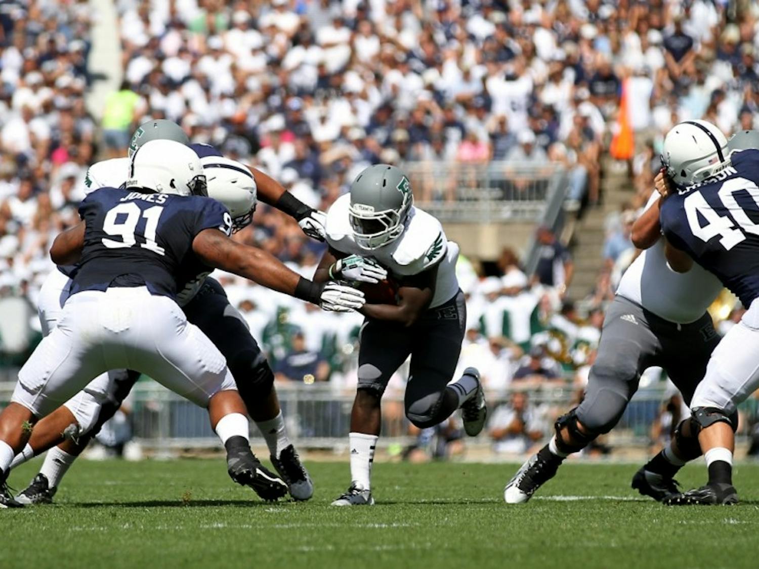 EMU running back Bronson Hill looks for the open hole to make a big run in the 1st quarter against Penn St.