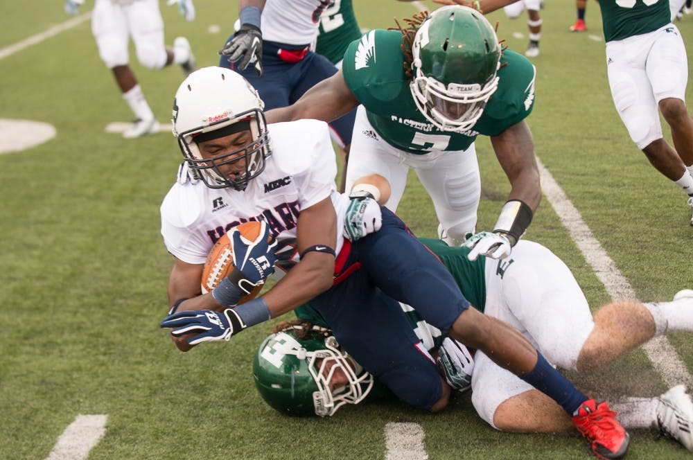 Howard reciever Matthew Colvin gets tackled by a pair of Eagles during the Bison's game a gainst Eastern Michigan on August 31 at Rynearson Stadium.