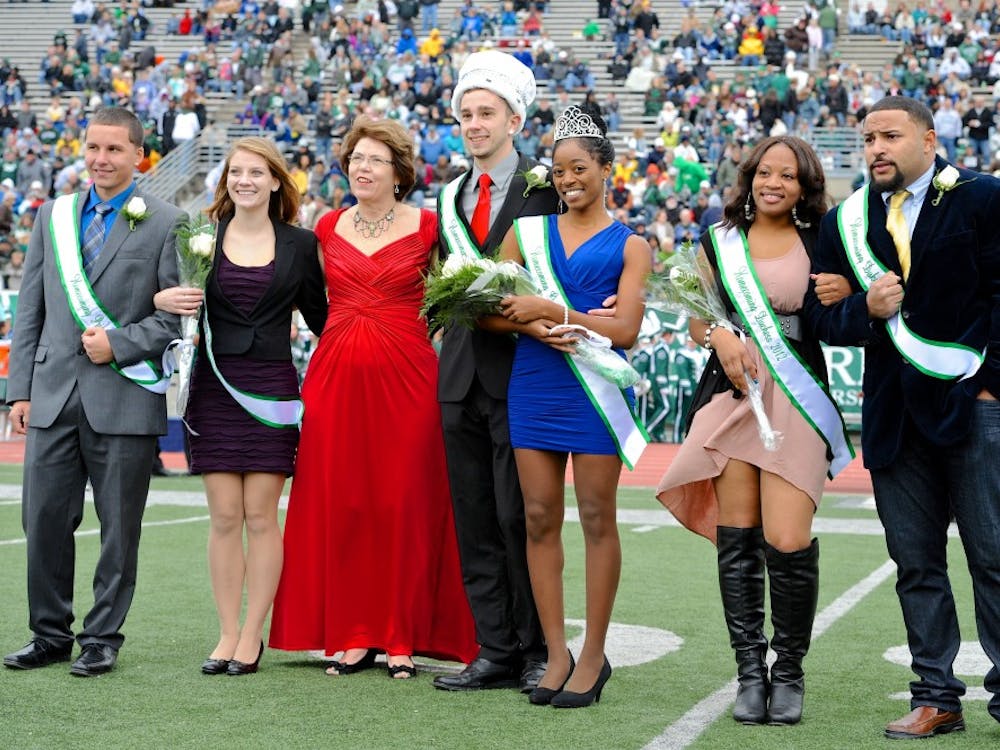 	Homecoming king Blake Navarre and queen Ja’La Wourman stand on the Rynearson Stadium field during halftime of the Eagles football game against Kent State.