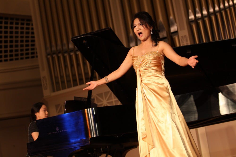 Kee Yung Yang, a visiting professor from Sookmyung University in Seoul, North Korea, performs Thursday. Songs performed were Westernized versions of Korean folk music. Themes included women and suffering.