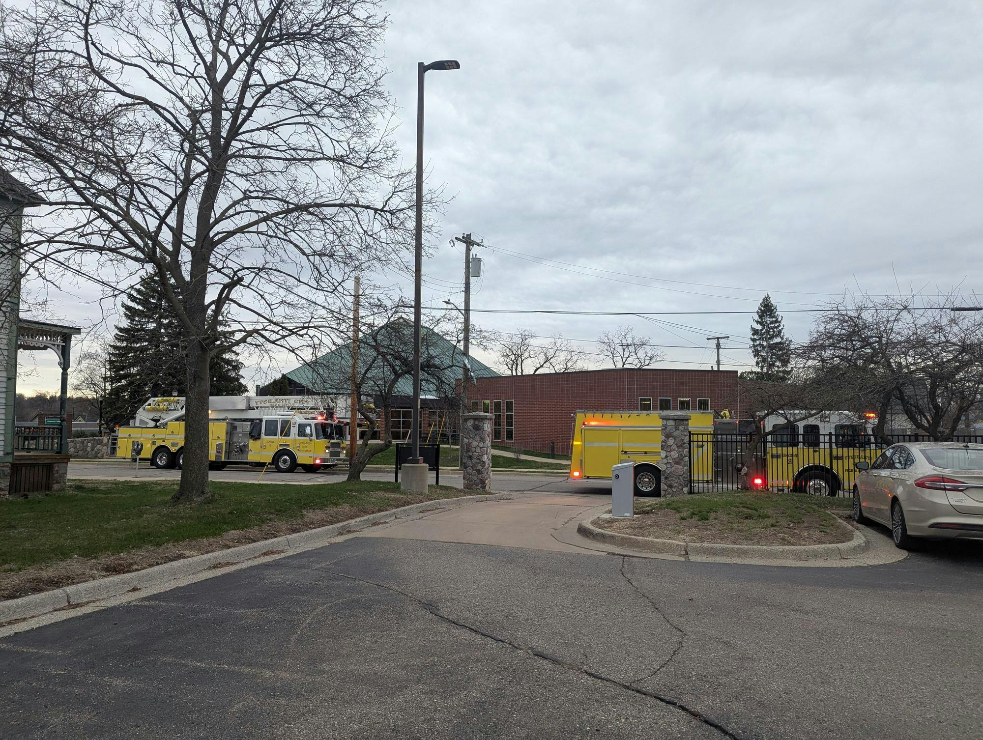 Two fire engines parked in front of a building.