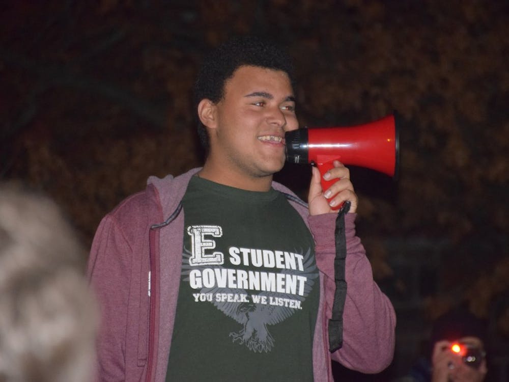Protest co-organizer Sam Jones-Darling addresses the gathered crowd at the #notmypresident rally outside of McKenny Hall on Monday, Nov. 14.