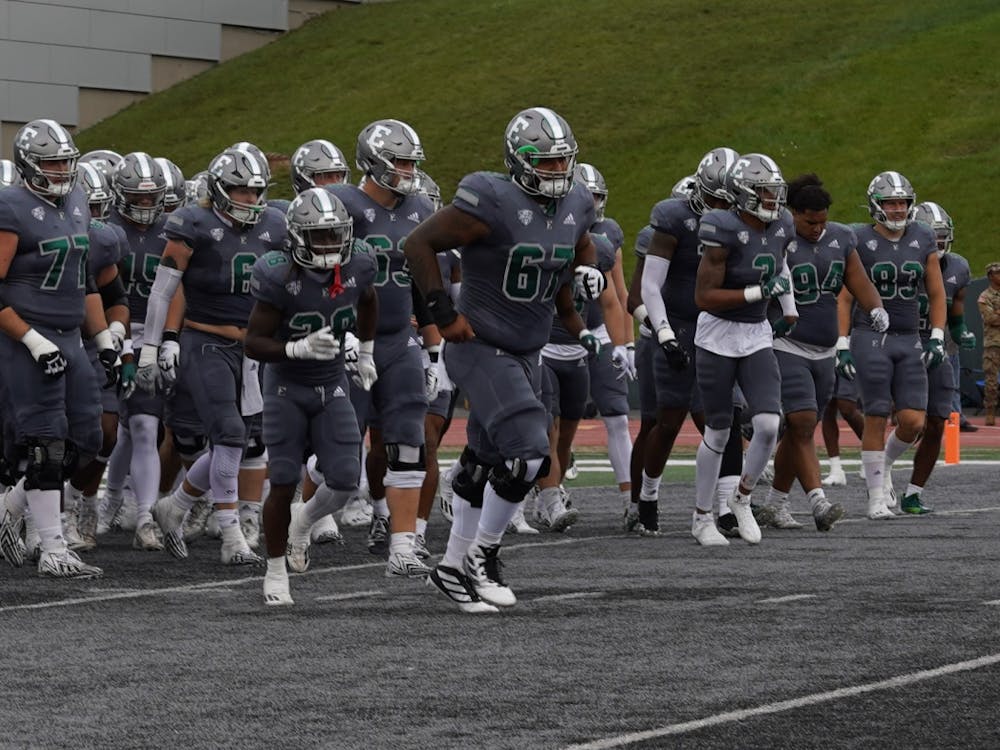 The Eastern Michigan University football team trots onto the field ahead of their matchup with the University of Massachusetts on Saturday, Sept.16, 2023, at Rynearson Stadium.