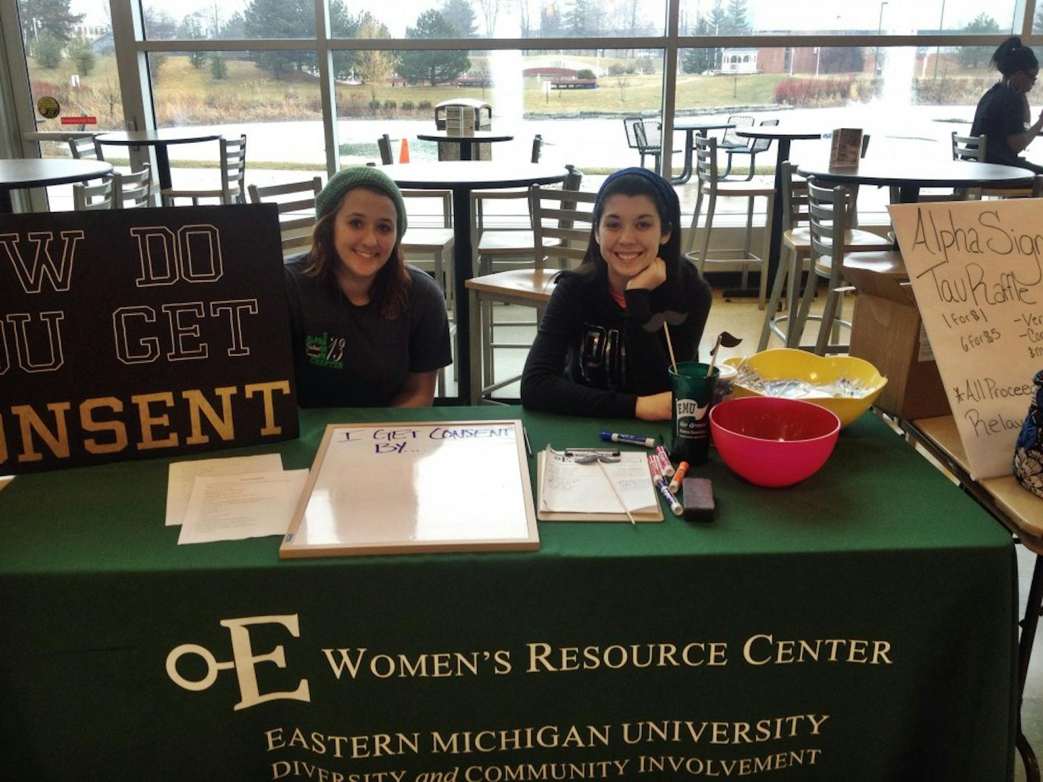 	Samm Snell (Left) and Laura Darnell (Right) work the Consent lobby table in the Student Center Friday afternoon.