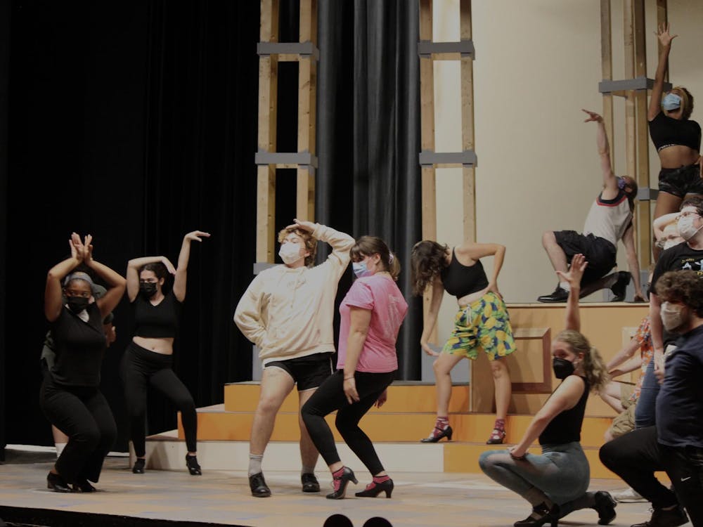 An array of characters in the EMU Theatre production of "Sweet Charity" pause as part of a musical number during a rehearsal for the show in September 2023. "Sweet Charity" runs from Oct. 19-22 on the Legacy Theatre stage in the Judy Sturgis Hill Building on Eastern's campus.