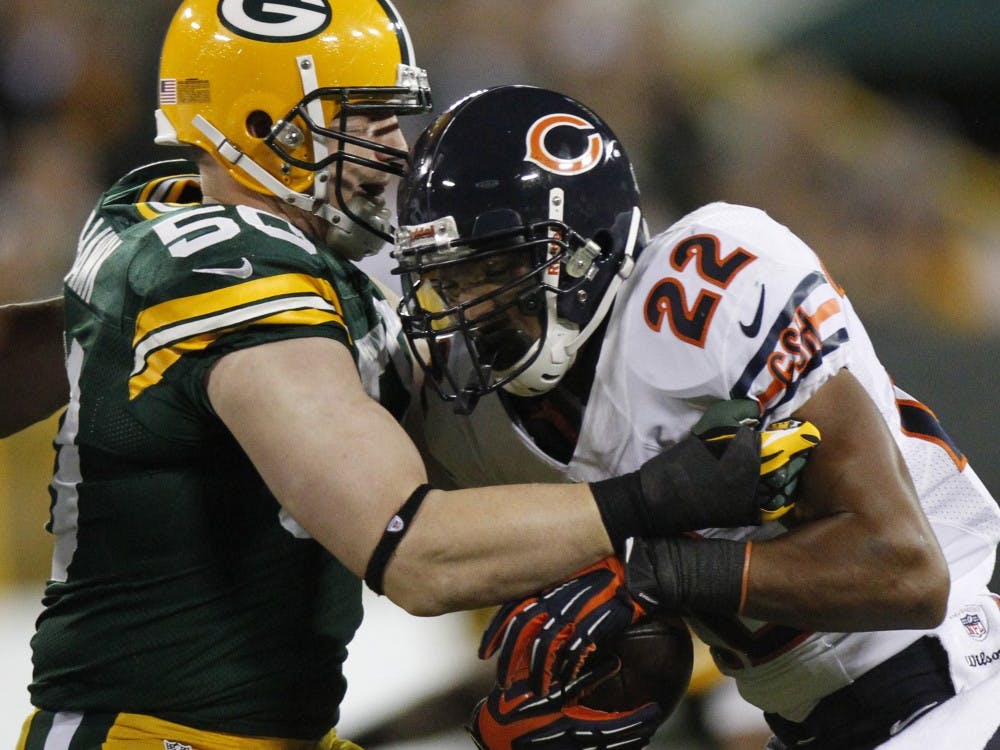 Chicago Bears running back Matt Forte is stopped by Green Bay Packers A.J. Hawk during the second quarter at Lambeau Field in Green Bay, Wisconsin, Thursday, September 13, 2012. The Packers won, 23-10. (Mark Hoffman/Milwaukee Journal Sentinel/MCT)