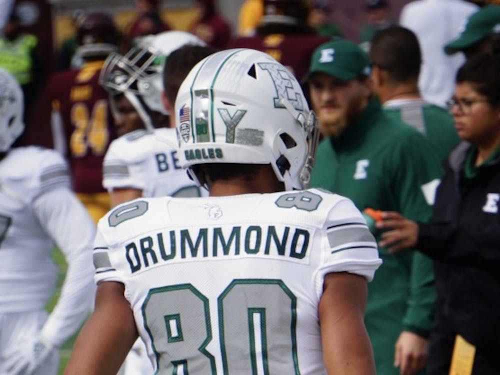 Eastern Michigan University football wideout Dylan Drummond walks back toward the bench during warm ups in this Eastern Echo file photo.