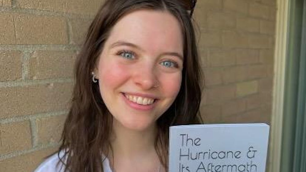Jordan Gretzner holding her novel
