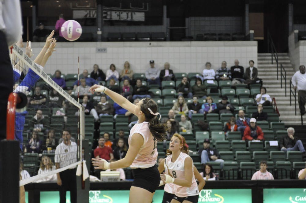 Volleyball, football teams raise money for breast cancer research