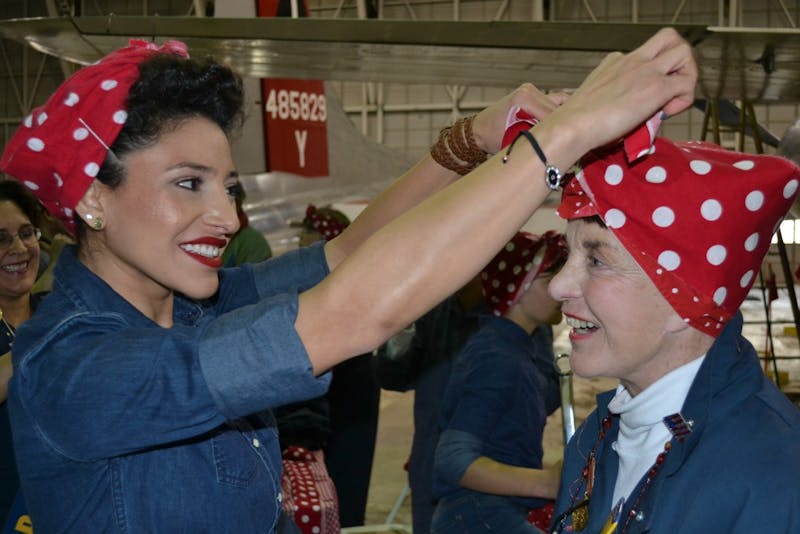 On October 30, The Yankee Air Museum attempted to set a Guinness World Record for “Most Rosies In One Place” in support of the campaign to save the Bomber Plant in Ypsilanti, Michigan. Women and young girls were invited to don the look of the iconic image of Rosie The Riveter, in the hopes of achieving the record of having 250 Rosies in one place but only 143 arrived. Regardless, high spirits were in the air and four real-life Rosies who worked at the Bomber Plant building B-24 liberators during World War II were also present.