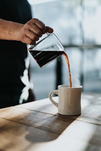 Man Pouring Black Coffee