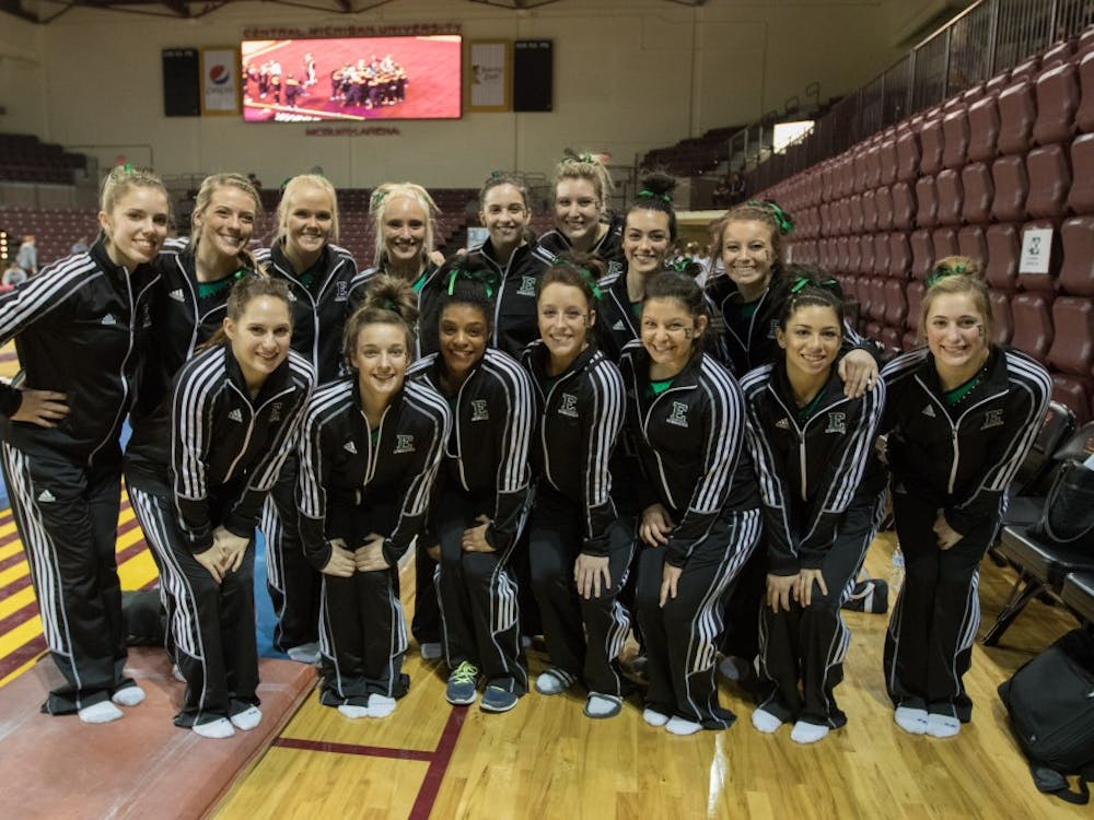 The Eastern Michigan Gymnastics team poses for a team photo after the Eagles finished 2nd against Central Michigan and Seattle Pacific Saturday night in Mt. Pleasant.