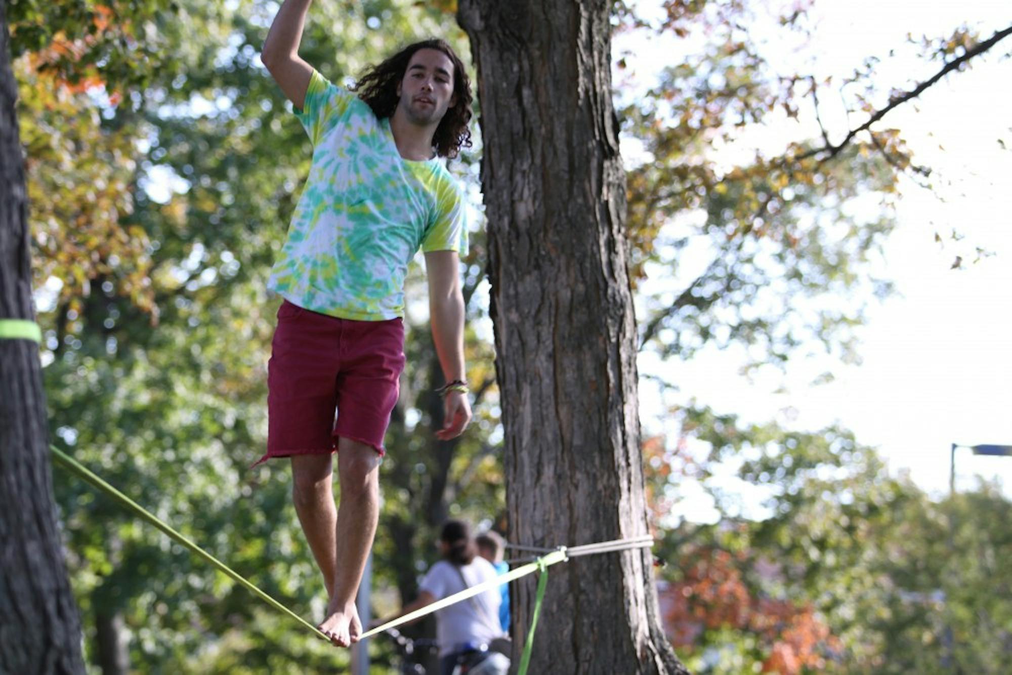 	Junior Joe Morris has been slack lining around campus since he discovered the sport his freshman year. The 20-year-old Morris reminds us that slack lining is not the same as tight rope walking. Unlike, tight rope walkers, slack liners balance on a rope that moves, which Morris said “makes it much harder.”