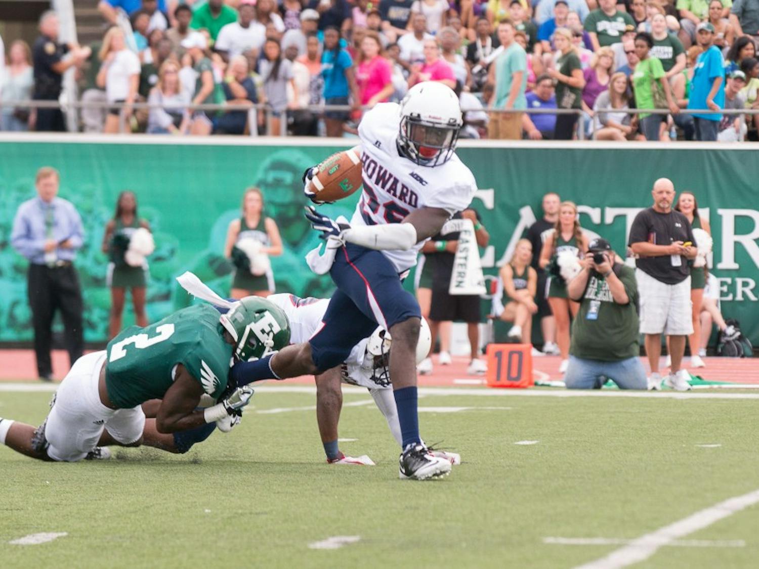 Howard defensive back Ademola Olatunji breaks a tackle after making an interception during the Bison's game against Eastern Michigan on August 31 at Rynearson Stadium.