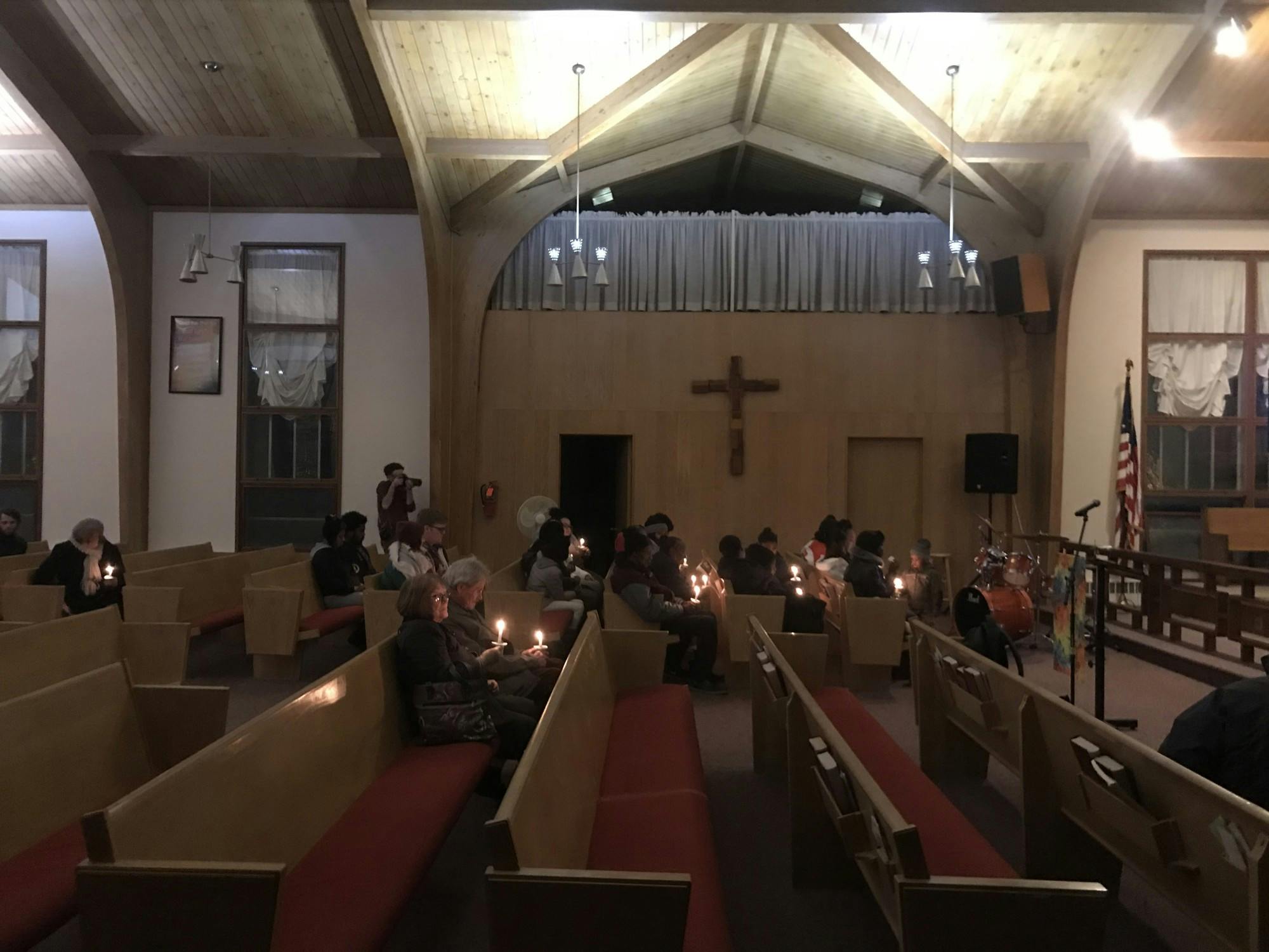 Community members attend prayer service for slain 21 year old man. 