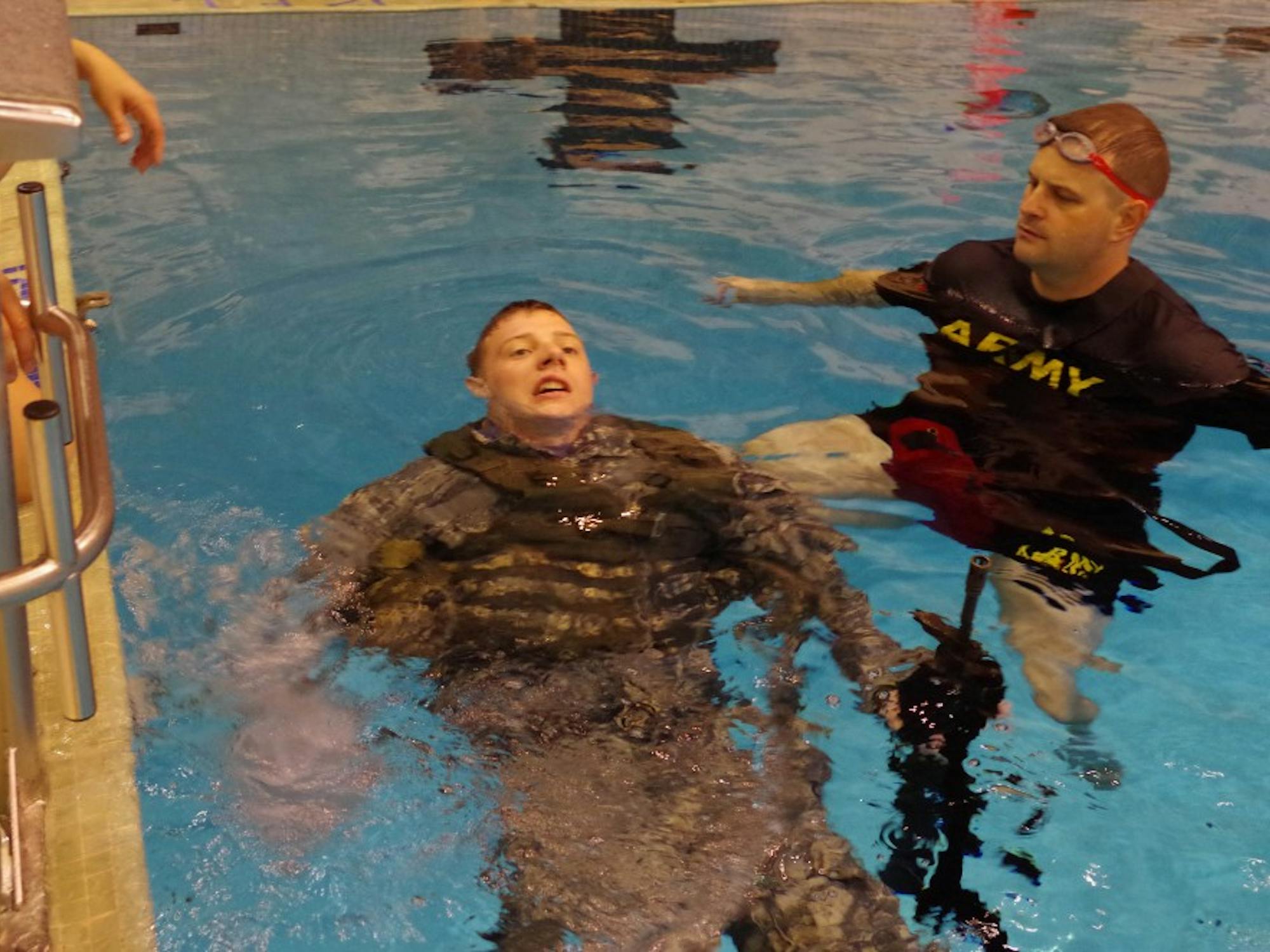 Kiley Albert, ROTC alpha company executive officer,&nbsp;swimming 15 meters with a dummy M16 rifle and full equipment.&nbsp;