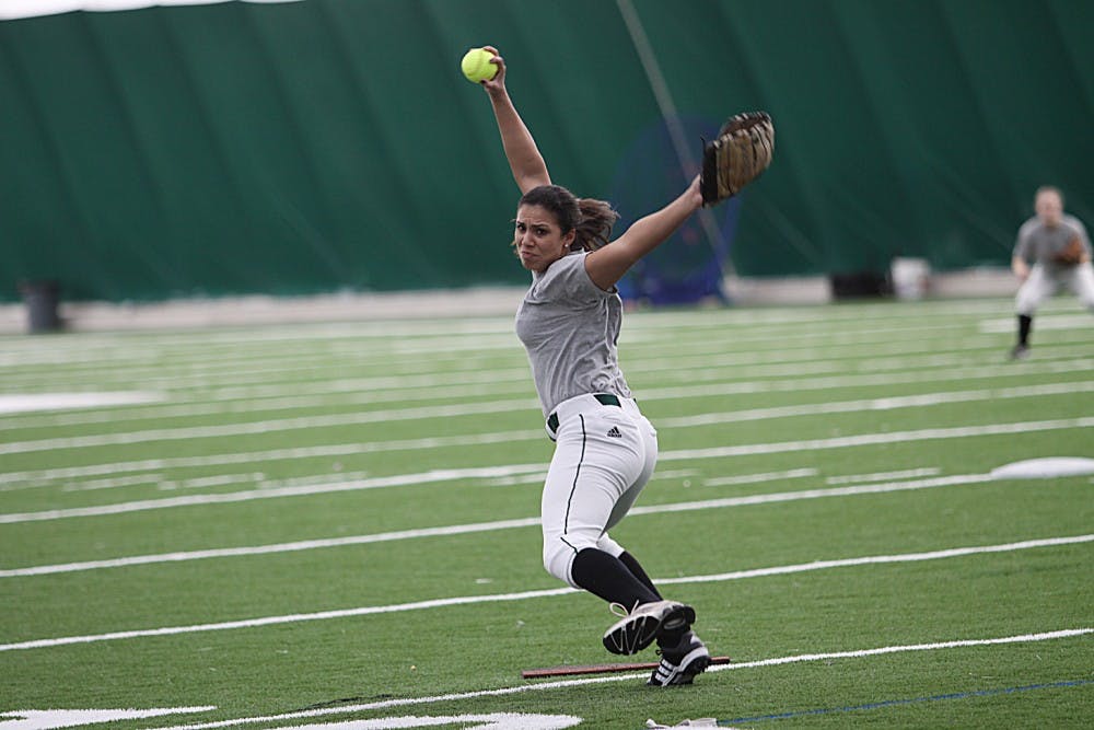 Senior Jaclyn Caro warms up for the upcoming softball season. Caro finished with a 1-5 record last season.