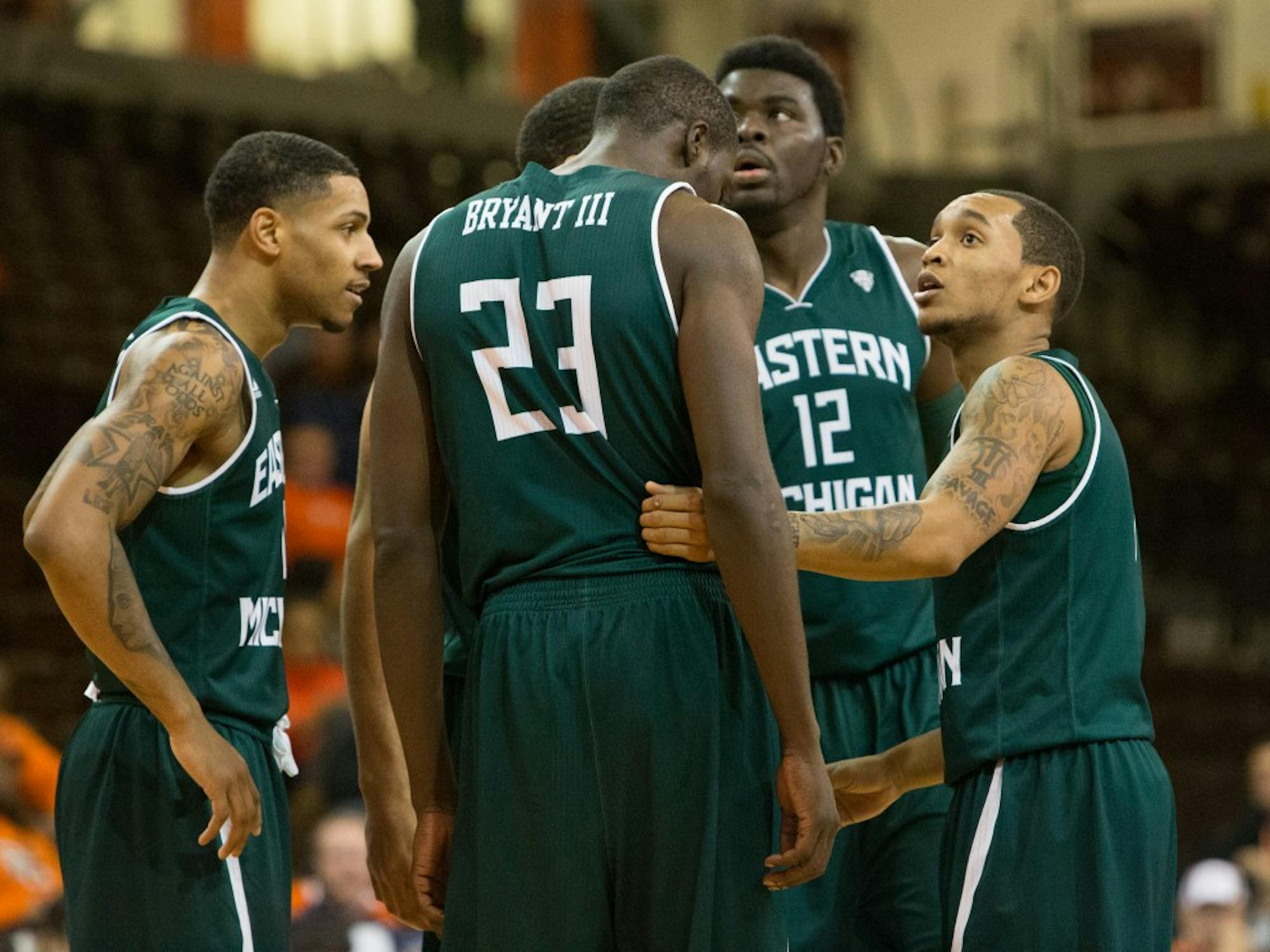 The team talks quick before a free throw attempt in Eastern Michigan's 56-51 win over Bowling Green Wednesday night.