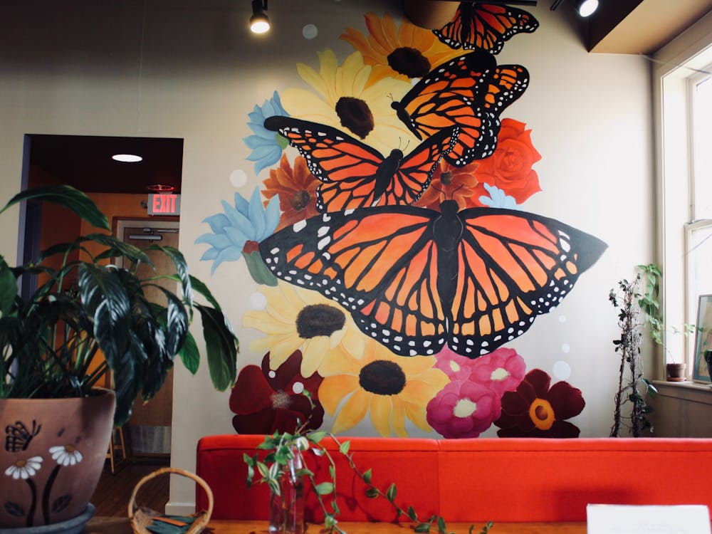 Bridge Community Café, located on W Michigan Ave, Ypsilanti, is decorated with colorful murals and furniture. 