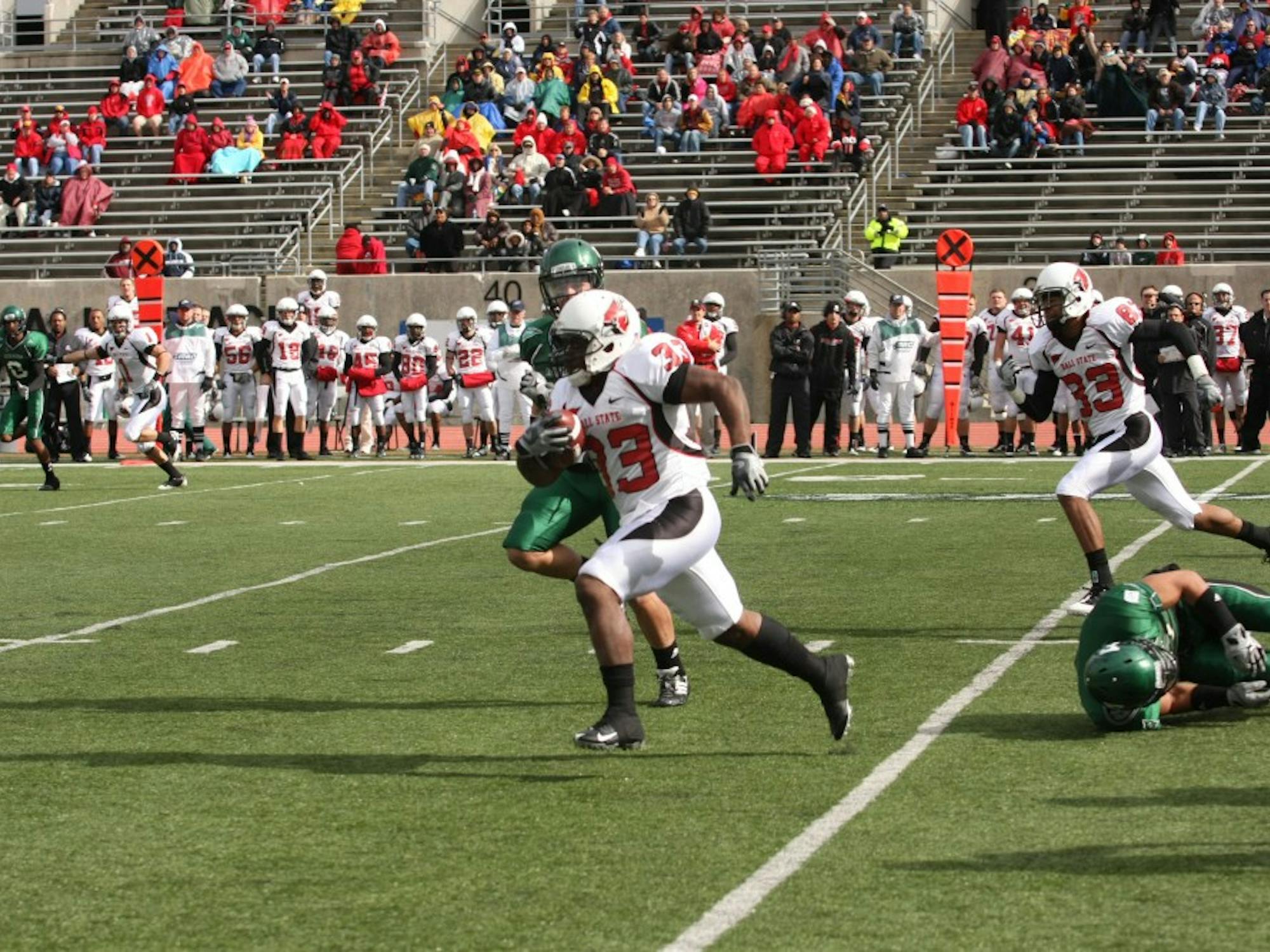 	Ball State&#8217;s MiQuale Lewis runs on Saturday against EMU. He had a school-record 301 yards rushing and a touchdown against the worst rush defense in the nation.