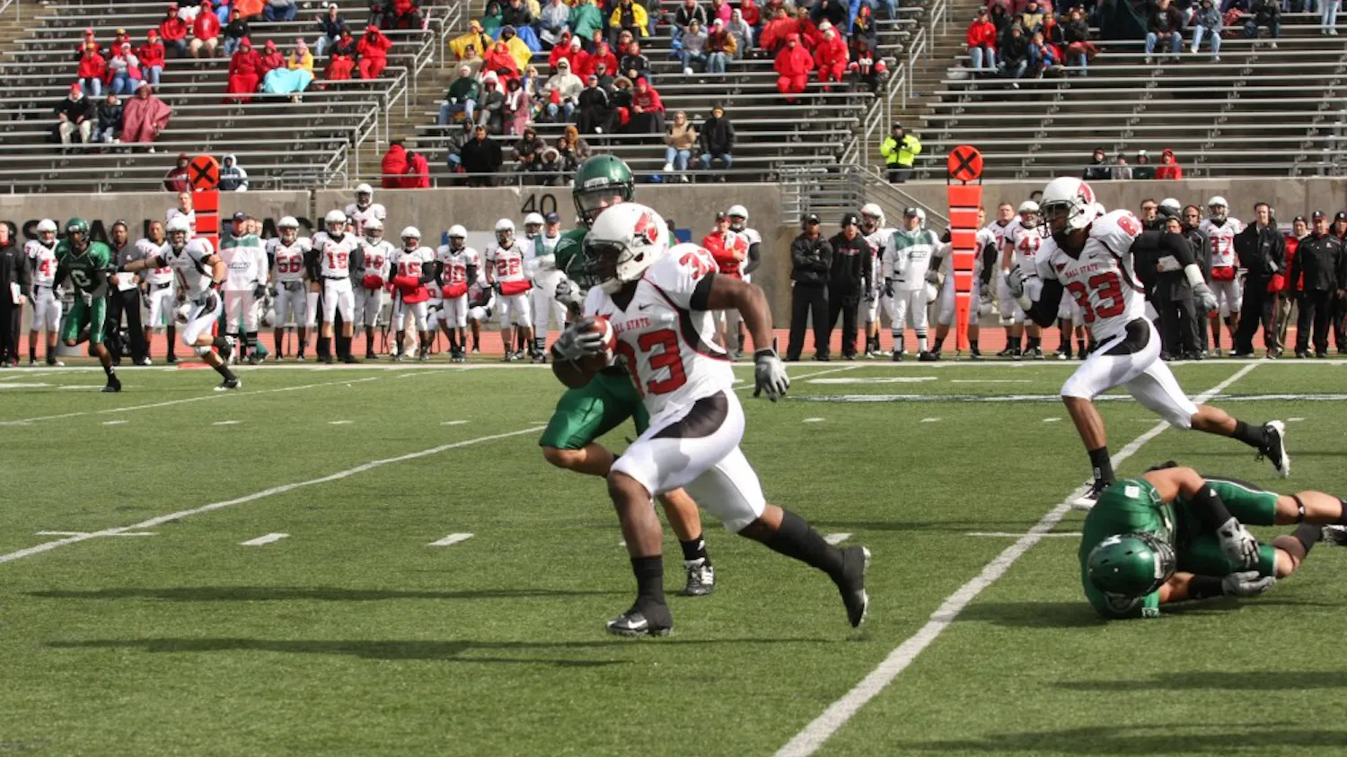 Ball State’s MiQuale Lewis runs on Saturday against EMU. He had a school-record 301 yards rushing and a touchdown against the worst rush defense in the nation.