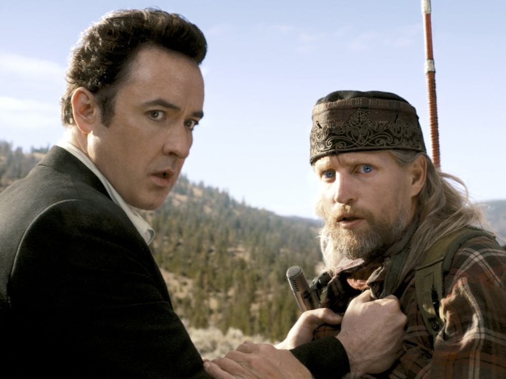 John Cusack, left, and Woody Harrelson star in Columbia Pictures “2012.”  The action film, released Nov. 13, depicts the end of the world as predicted by the Mayan calendar 