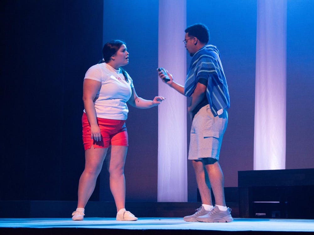 Lifeguard Erika, left, played by Laney Bass and Dontrell Jones, III, played by Chandler Graham performs in EMU theatre's “Dontrell, Who Kissed the Sea” during dress rehearsal.  