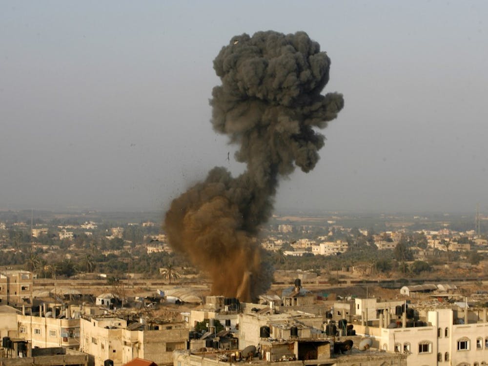 Smoke rises after an Israeli airstrike Monday, November 19, 2012, in Rafah in southern Gaza Strip. (Eyad Al Baba/APA Images/Zuma Press/MCT)