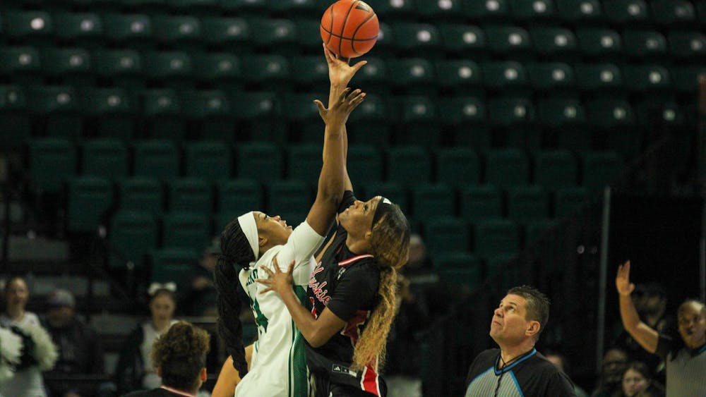 #14 Sisi Eleko taking the opening tip-off