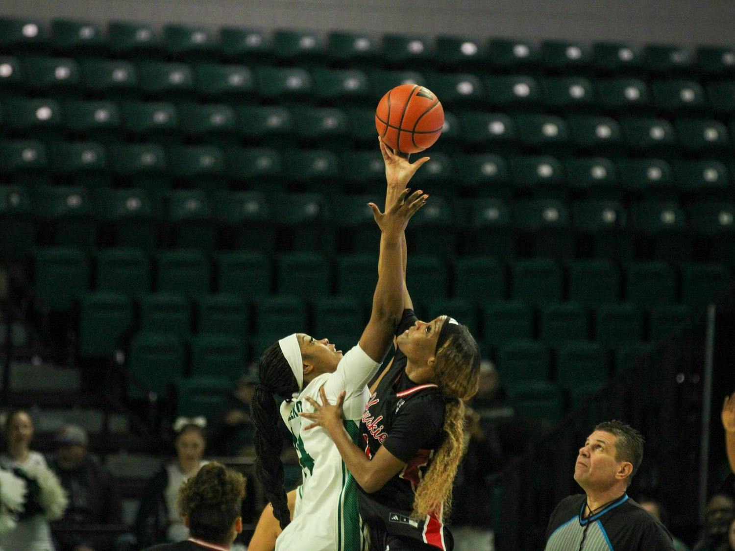 #14 Sisi Eleko taking the opening tip-off