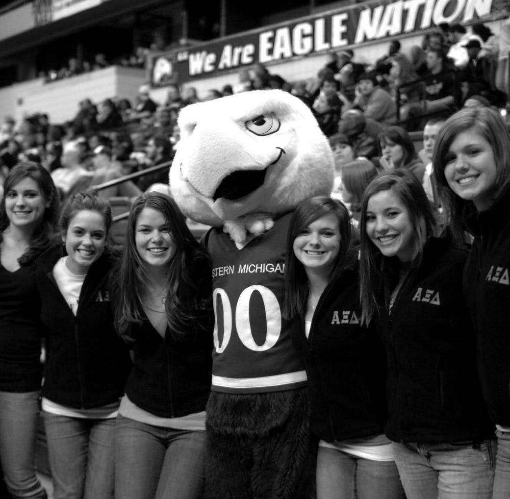 	Students gather with Swoop during an EMU Men’s Basketball game on Greek Organization day at the Convocation Center.