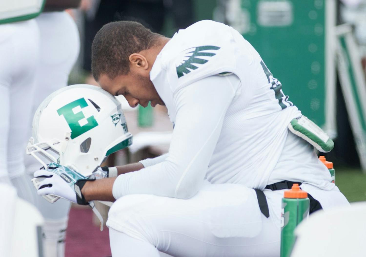 EMU tight end Tyreese Russell takes a moment before kickoff in Eastern Michigan's 42-10 loss to Central Michigan Friday afternoon in Mount Pleasant.