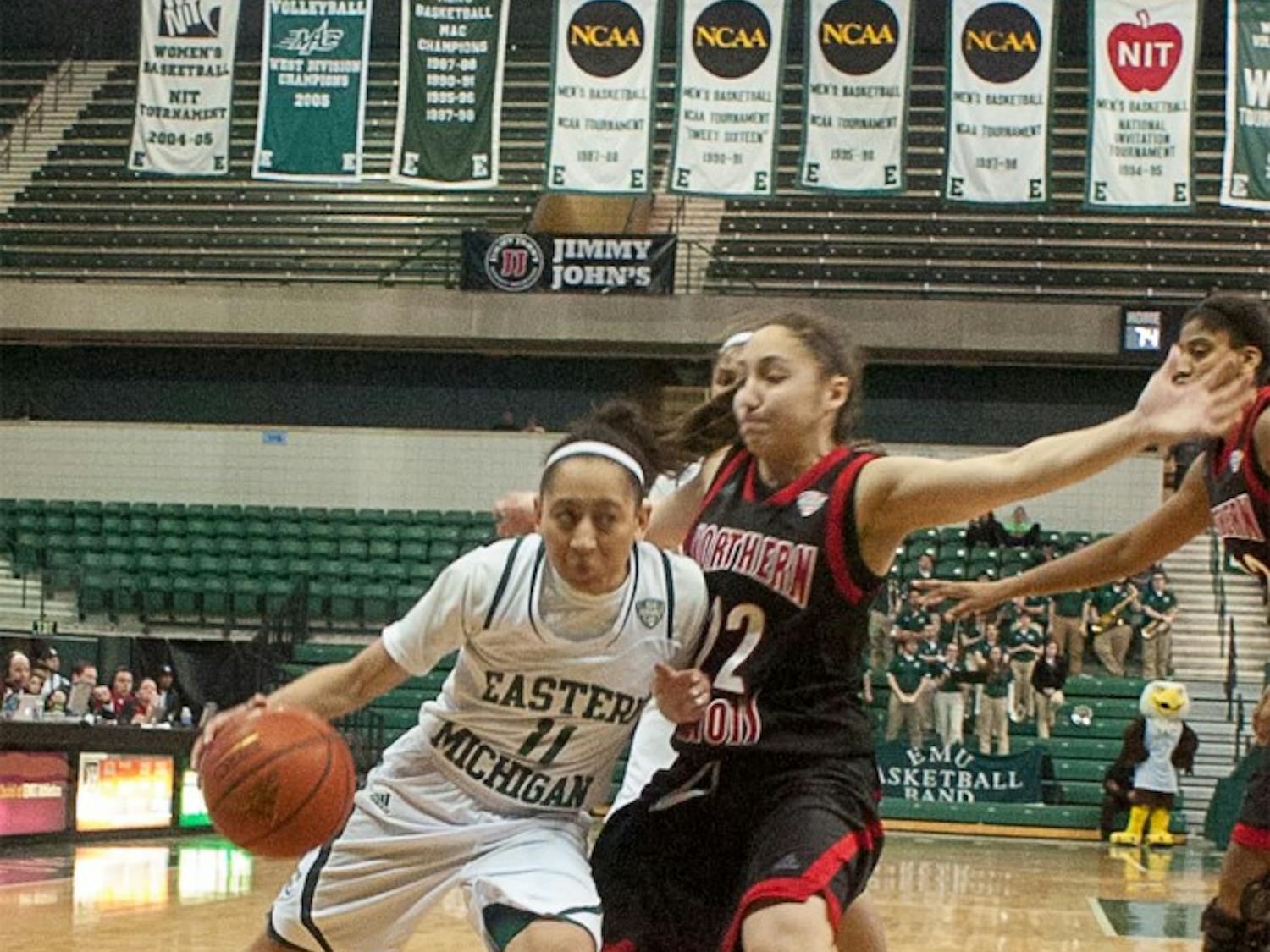 Eastern Michigan guard Desyree Thomas pushes her way around the defense during the Eagles' 76-81 overtime loss to Northern Illinois on 10 March at the Convocation Center.