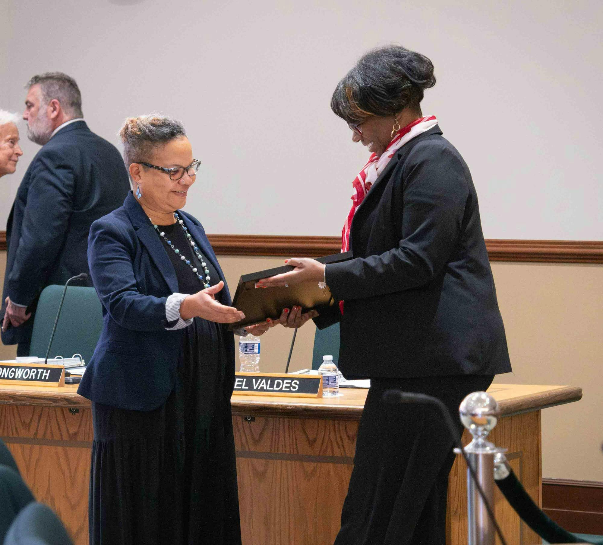 Toni Pressley-Sanon recieves an award from Jessie K.W. Kimbrough and both are smiling.