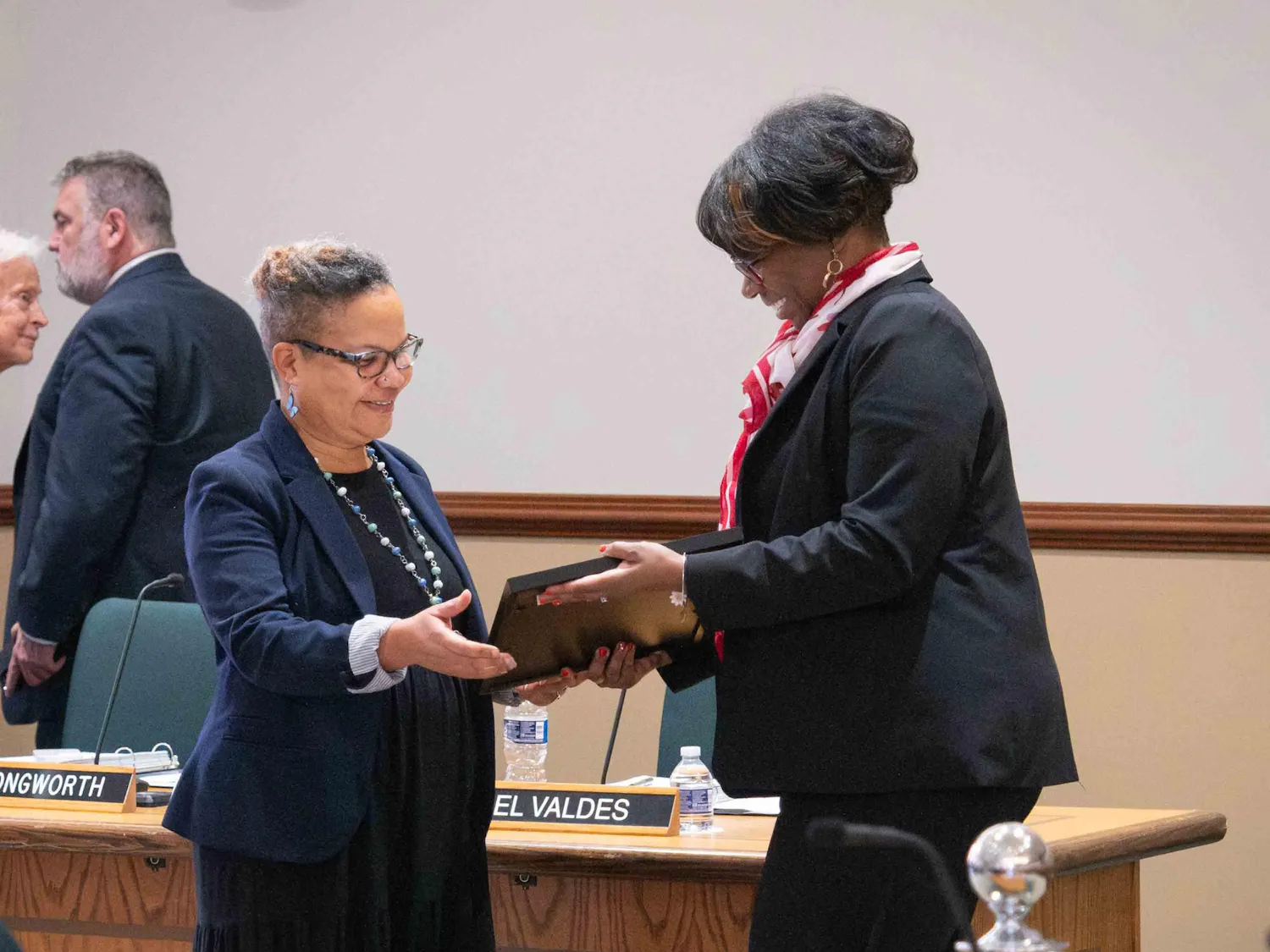 Toni Pressley-Sanon recieves an award from Jessie K.W. Kimbrough and both are smiling.
