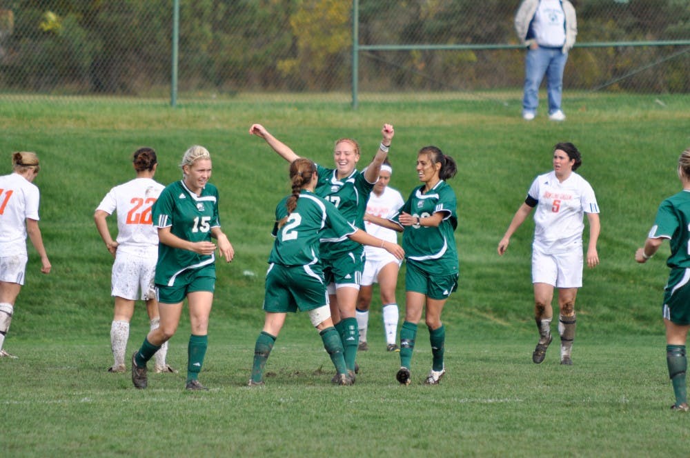 	Amanda Marsh (2) celebrates her goal with teammates Sunday.