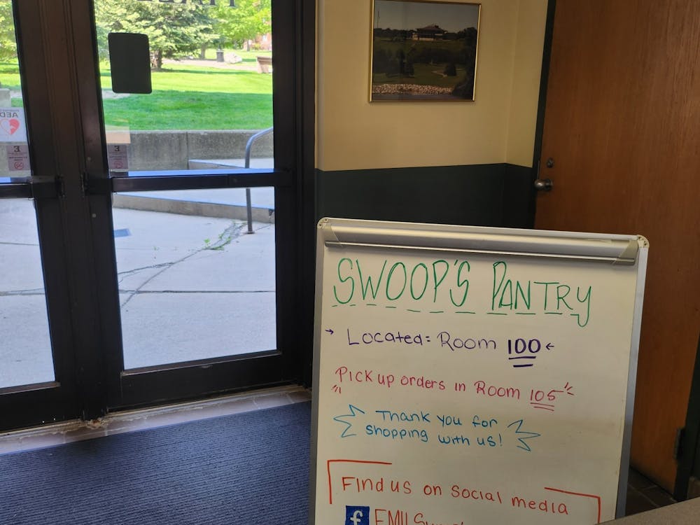Swoops pantry white board sign welcomes visitors.