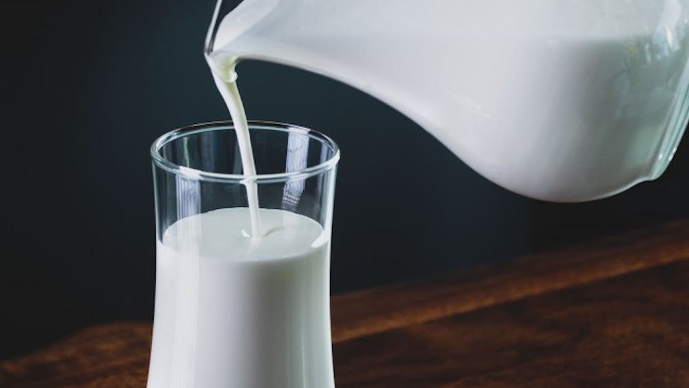 Pouring glass of milk