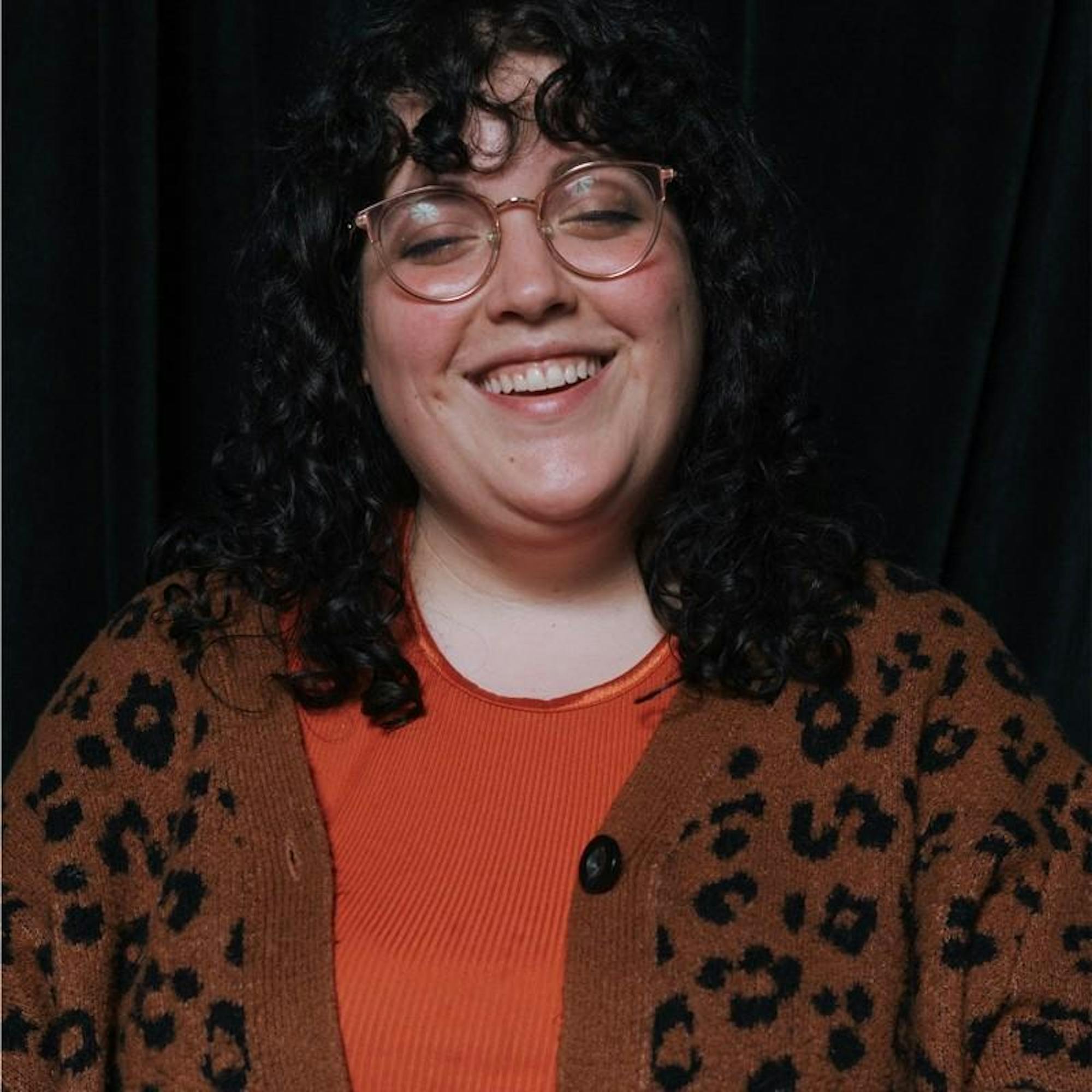 A headshot of Jada Hauser, smiling at the camera.