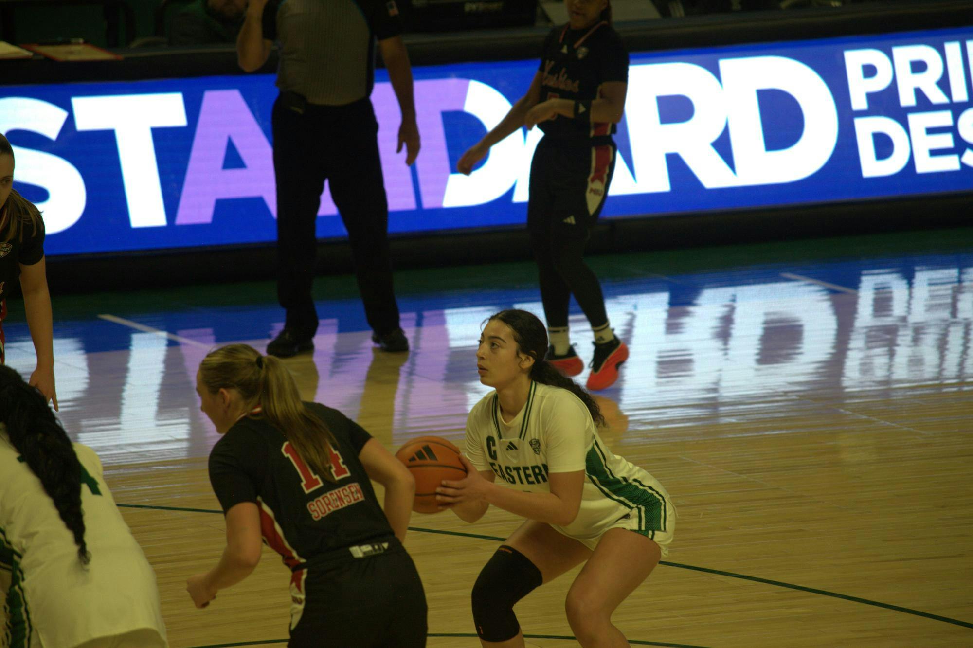 Eastern Michigan Women's Basketball player aims for free shot.