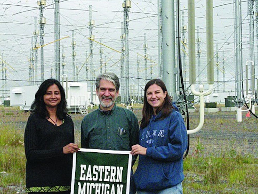 Left to right: Nargis Adham, Prof Sheerin, and Audelia Wittbrodt under the 35-acre HF antenna array. 