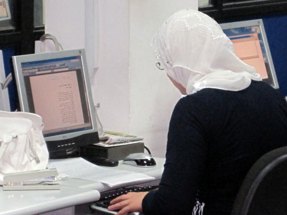 A journalist works at the offices of al Mada newspaper in Baghdad. The paper is the latest media organization to face a potential lawsuit, after printing an essay lampooning parliament. 