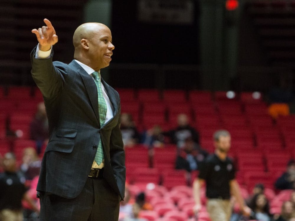 Eastern Michigan head coach Rob Murphy calls out the play in the Eagles 61-59 double overtime loss to Northern Illinois Thursday in Dekalb.