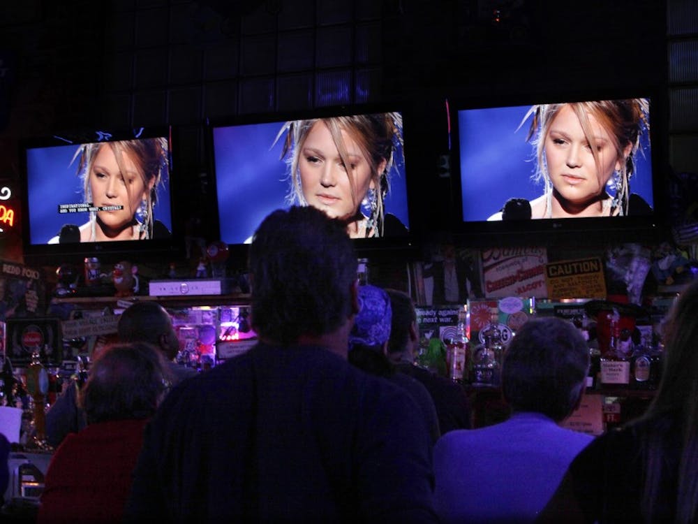 "American Idol" contender Crystal Bowersox, seen on several TV screens while performing on the Fox show, in The Village Idiot in Maumee, Ohio. Bowersox played in the bar regularly before she won a spot on "American Idol." (Nancy Stone/Chicago Tribune/MCT)
