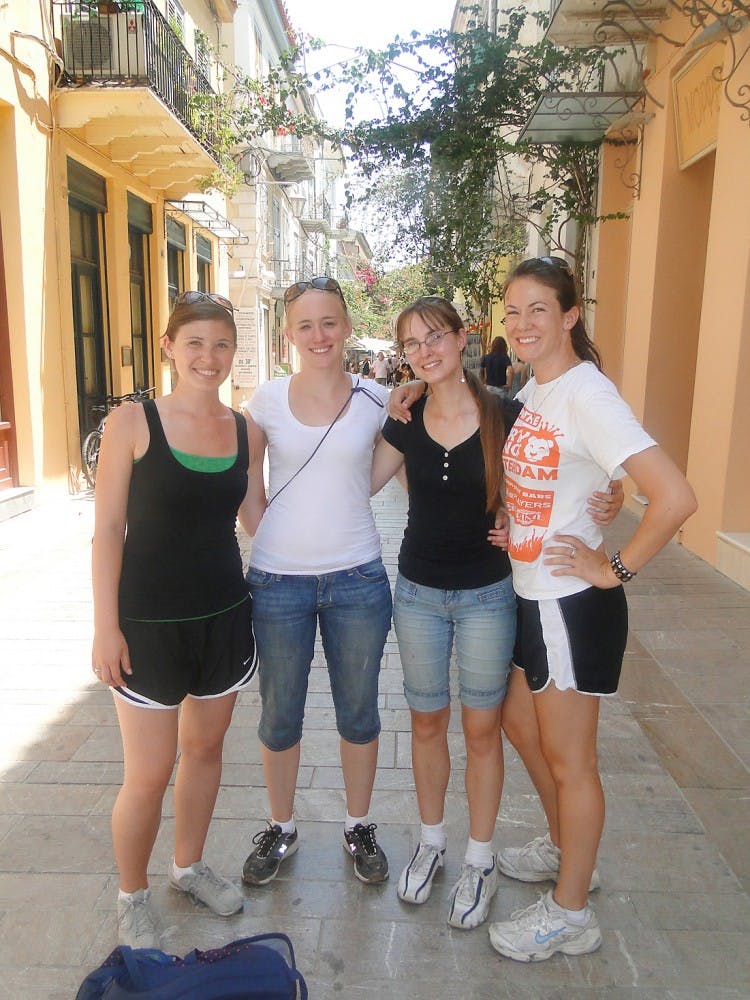 Eastern students Jenny Cannell, Megan Byrne, Danielle Sebranek and Kelli Bass stop for a history lesson and lunch in Nafplion, Greece.