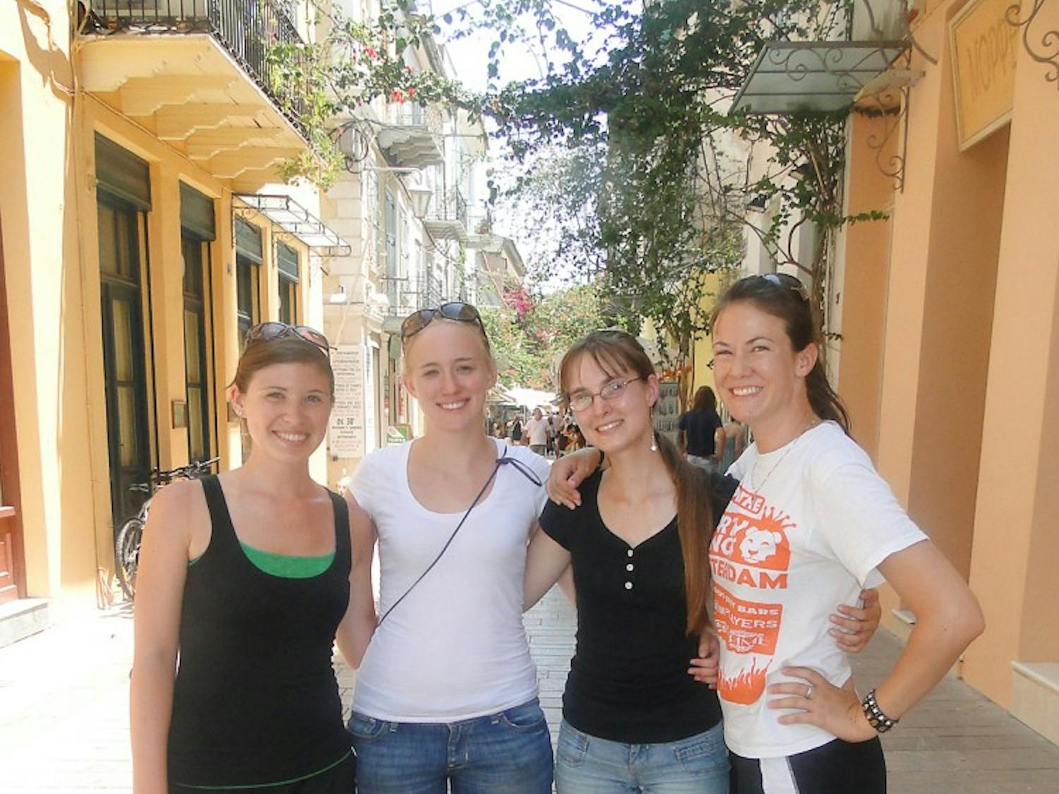 Eastern students Jenny Cannell, Megan Byrne, Danielle Sebranek and Kelli Bass stop for a history lesson and lunch in Nafplion, Greece.