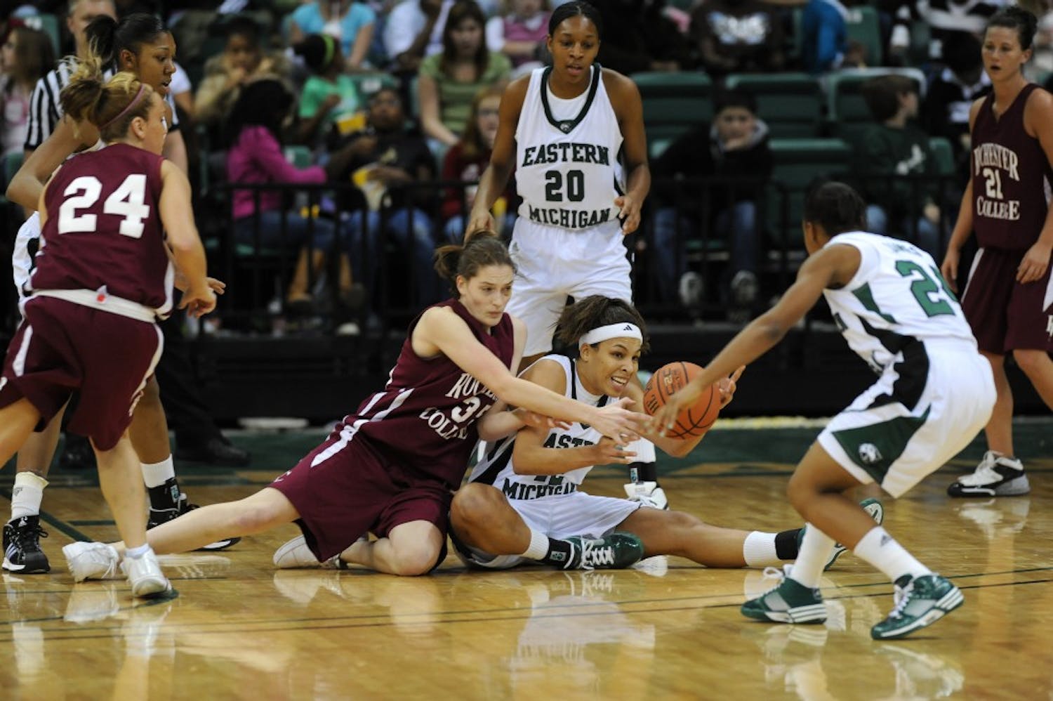 	Eastern Michigan and Rochester College players wrestle for the ball Wednesday.